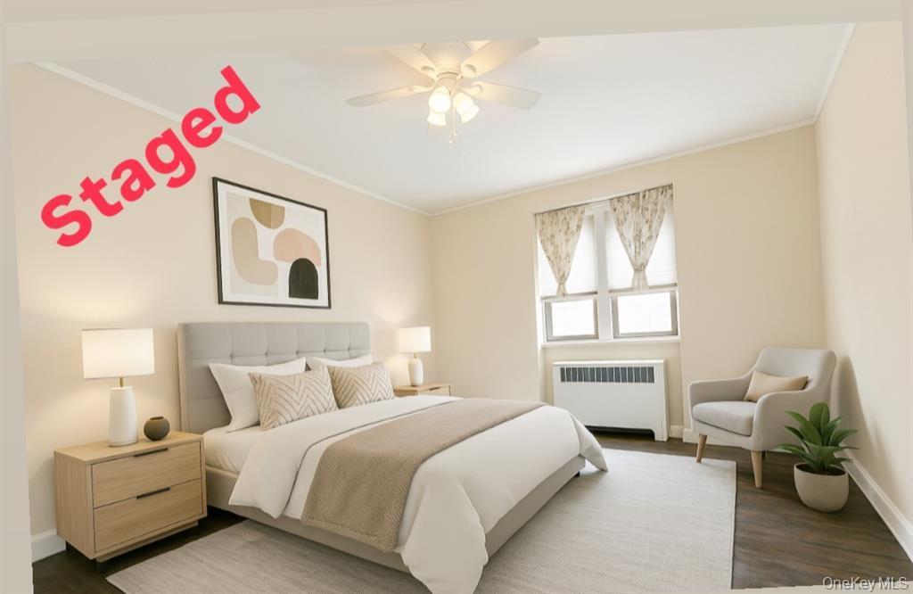 2 Town House Place, Unit 3N Great Neck, NY 11021 - Photo 14 of 26 a bedroom with a bed and furniture