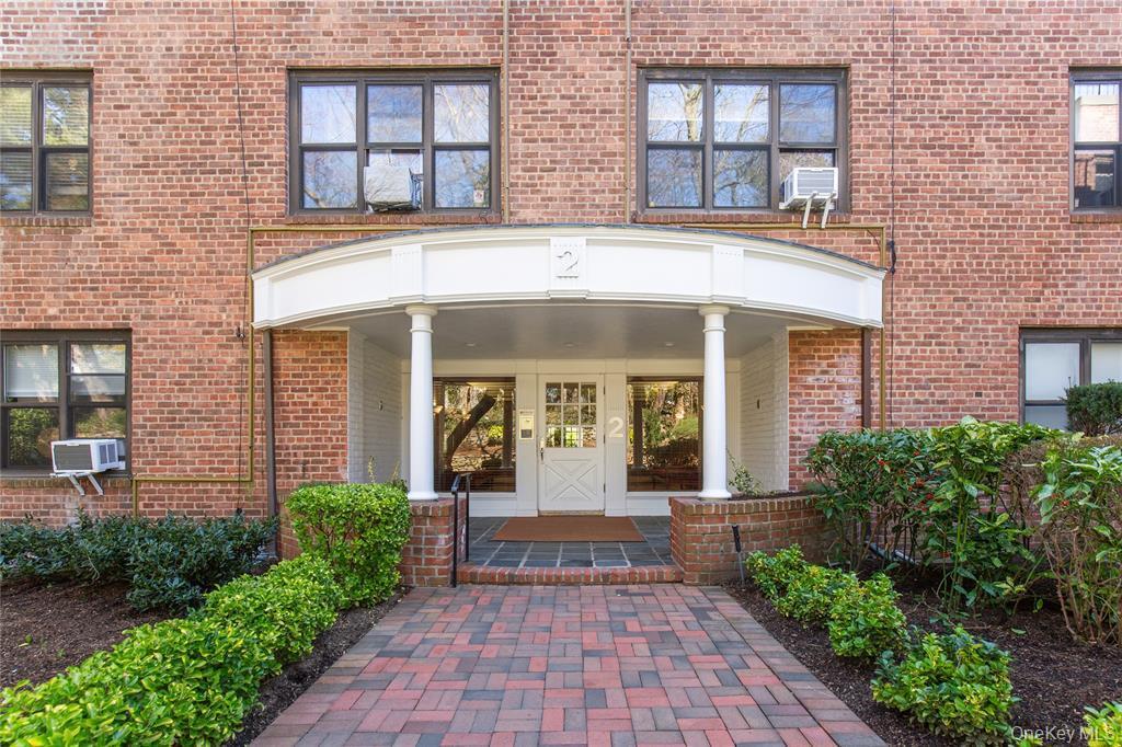 2 Town House Place, Unit 3N Great Neck, NY 11021 - Photo 3 of 26 front view of a brick house