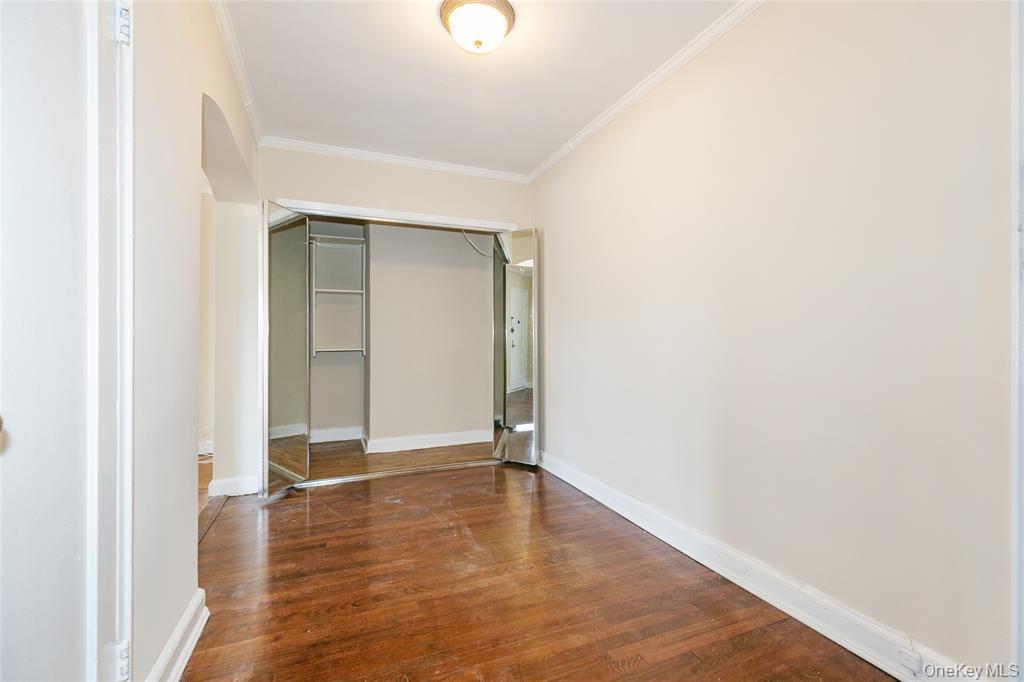 2 Town House Place, Unit 3N Great Neck, NY 11021 - Photo 8 of 26 a view of an empty room with wooden floor