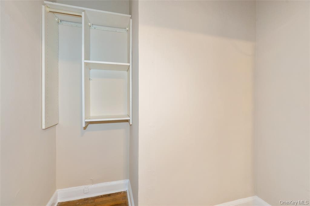 2 Town House Place, Unit 3N Great Neck, NY 11021 - Photo 9 of 26 a view of walk in closet with empty racks