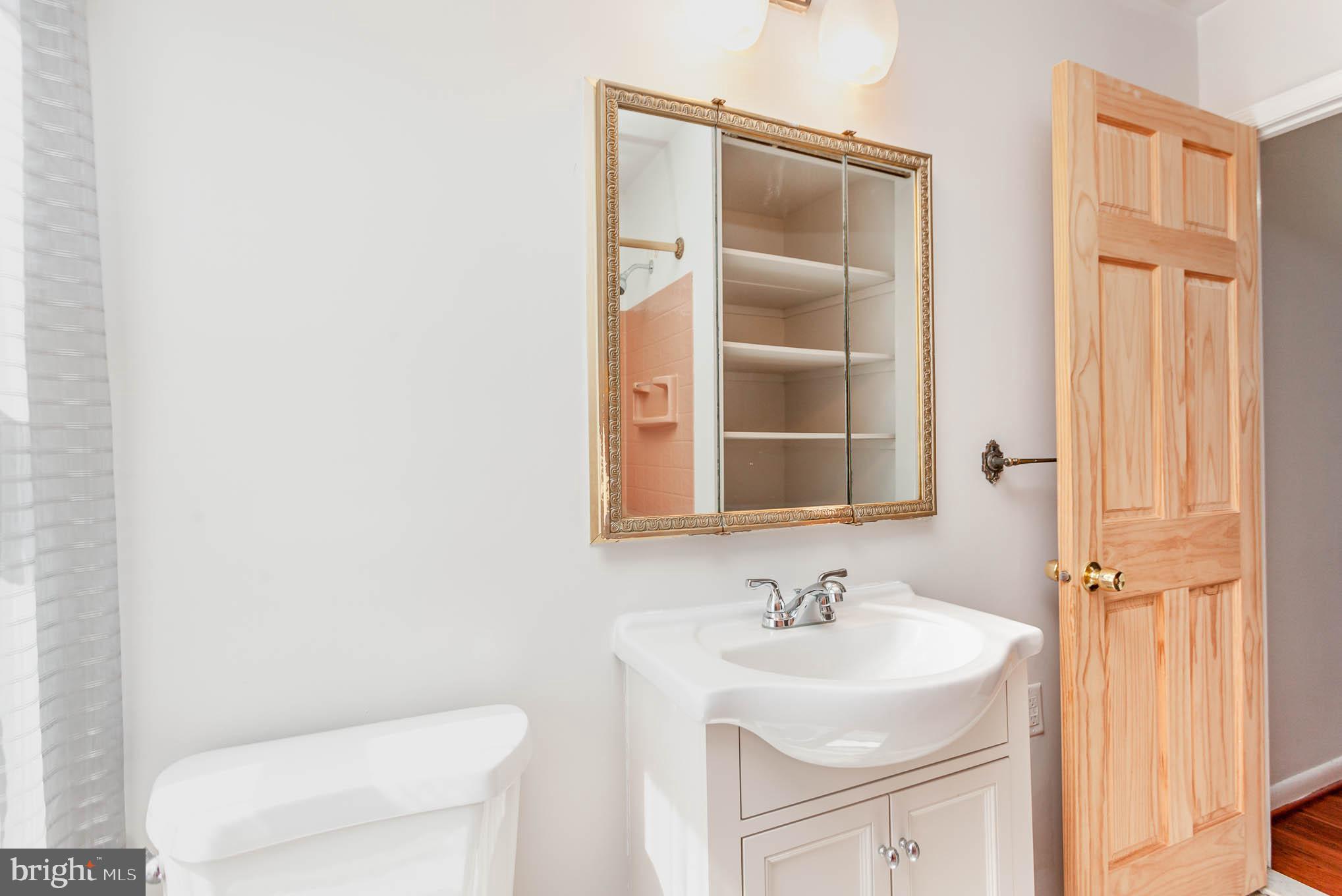 1776 Stokesley Road Dundalk, MD 21222 - Photo 11 of 24 Full bath offers updated lighting, vanity & toilet