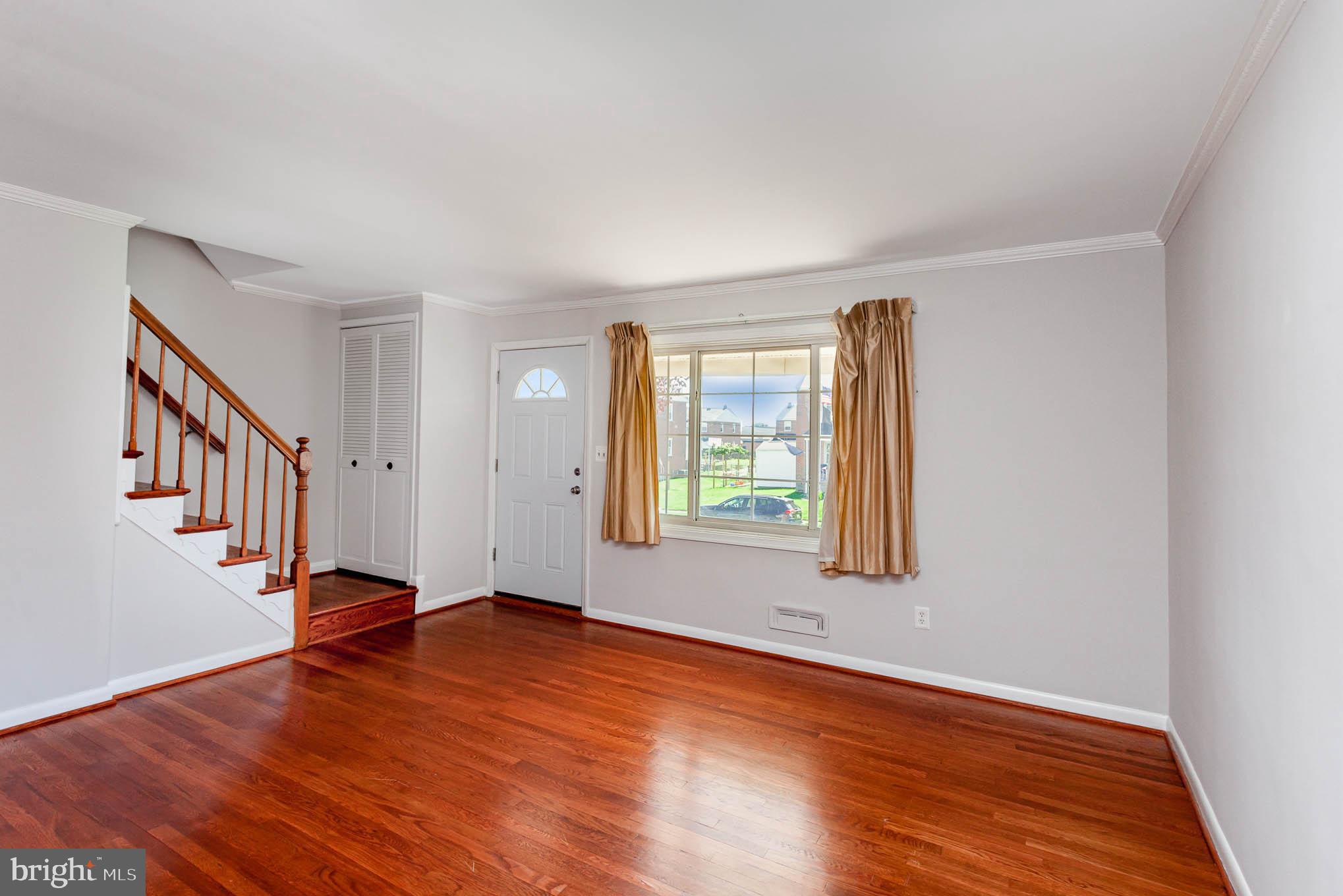 1776 Stokesley Road Dundalk, MD 21222 - Photo 4 of 24 Living room with gleaming hardwood floors