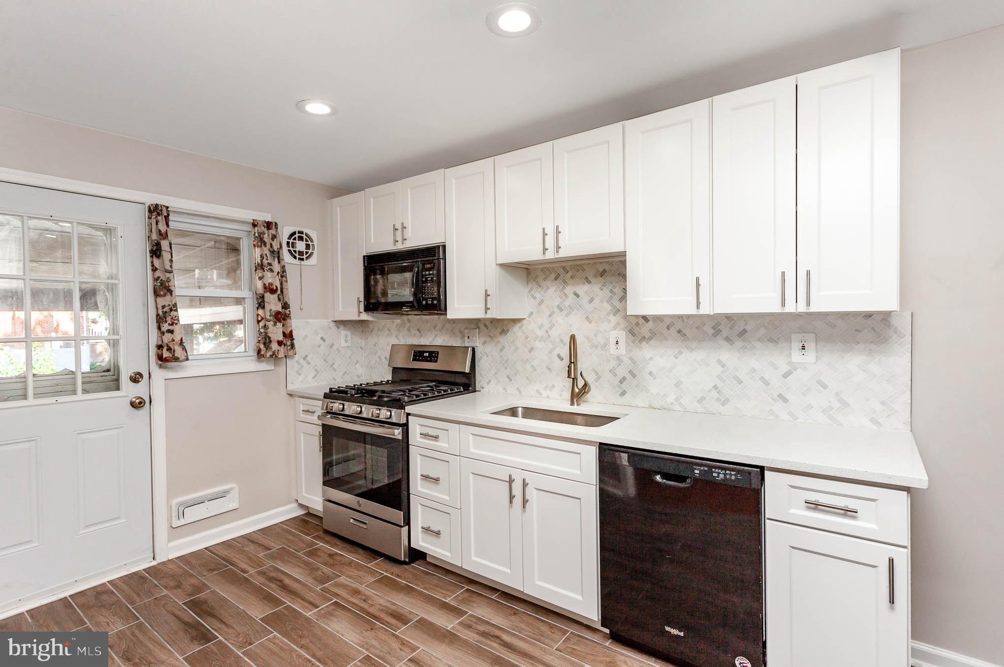 1776 Stokesley Road Dundalk, MD 21222 - Photo 7 of 24 Black & stainless appliances gorgeous backsplash