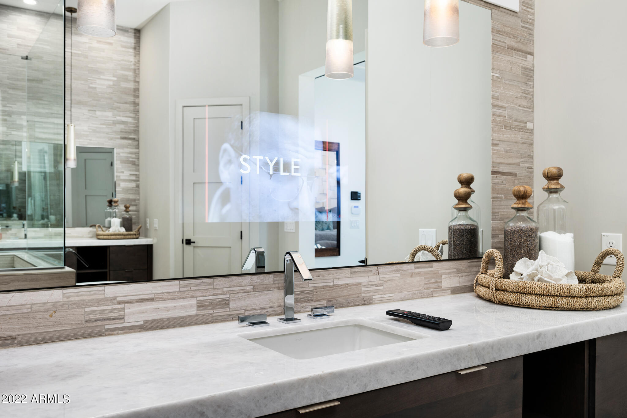 17338 East Bobwhite Way Rio Verde, AZ 85263 - Photo 26 of 77 TV Through Bathroom Mirror