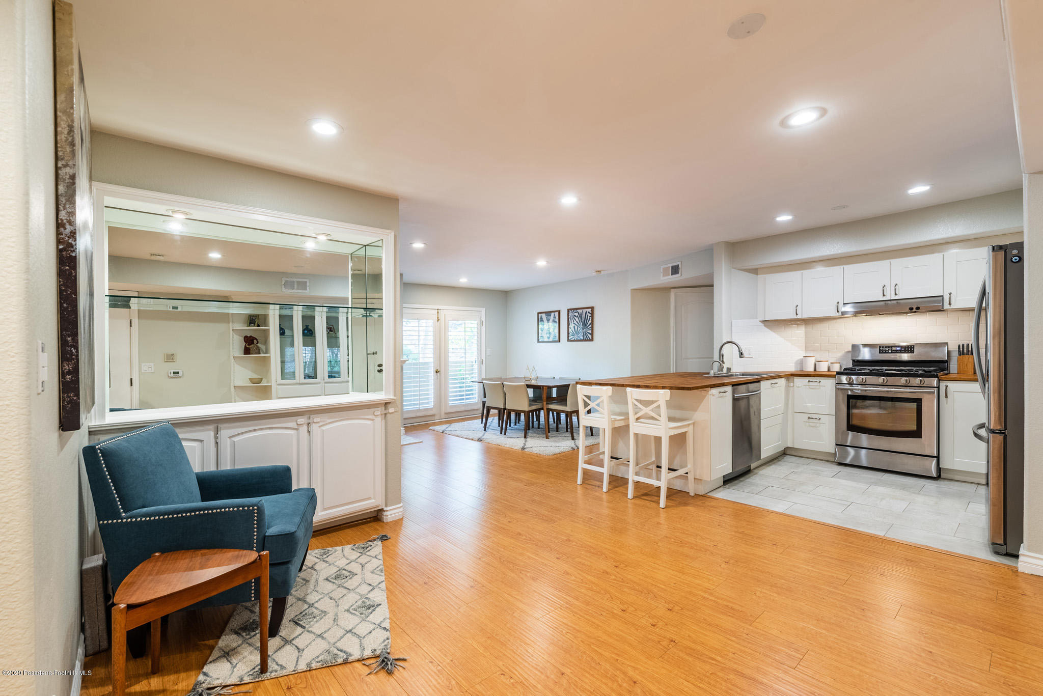 6140 Monterey Road, Unit 328 Los Angeles, CA 90042 - Photo 1 of 28 a living room with dining table furniture wooden floor and a kitchen view