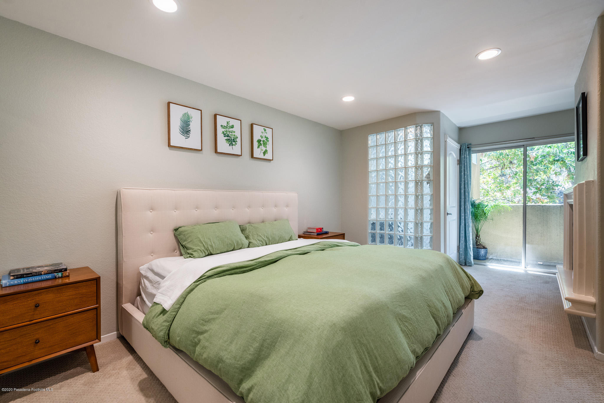 6140 Monterey Road, Unit 328 Los Angeles, CA 90042 - Photo 12 of 28 a bed sitting in a bedroom next to a window
