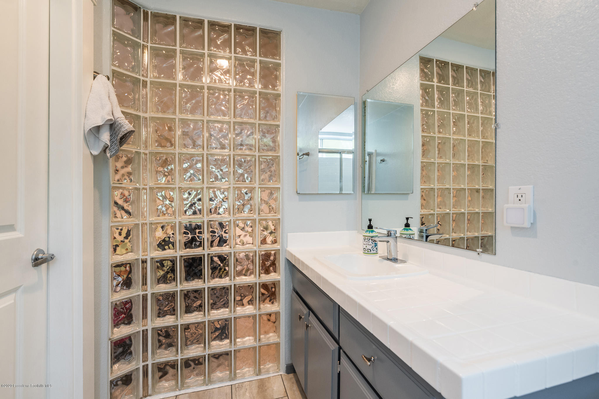6140 Monterey Road, Unit 328 Los Angeles, CA 90042 - Photo 16 of 28 a bathroom with a sink shower and a mirror