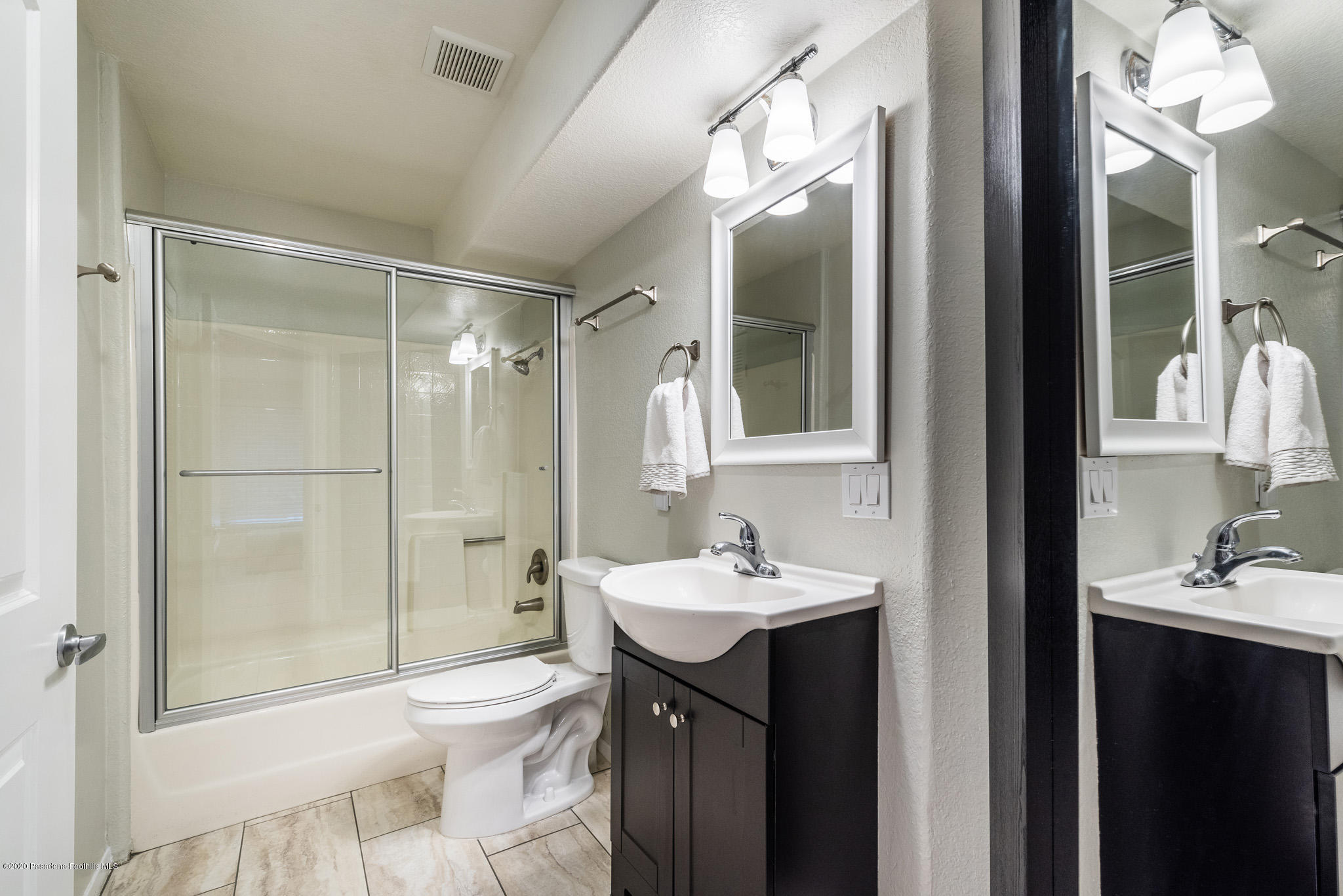 6140 Monterey Road, Unit 328 Los Angeles, CA 90042 - Photo 19 of 28 a bathroom with a sink toilet and shower