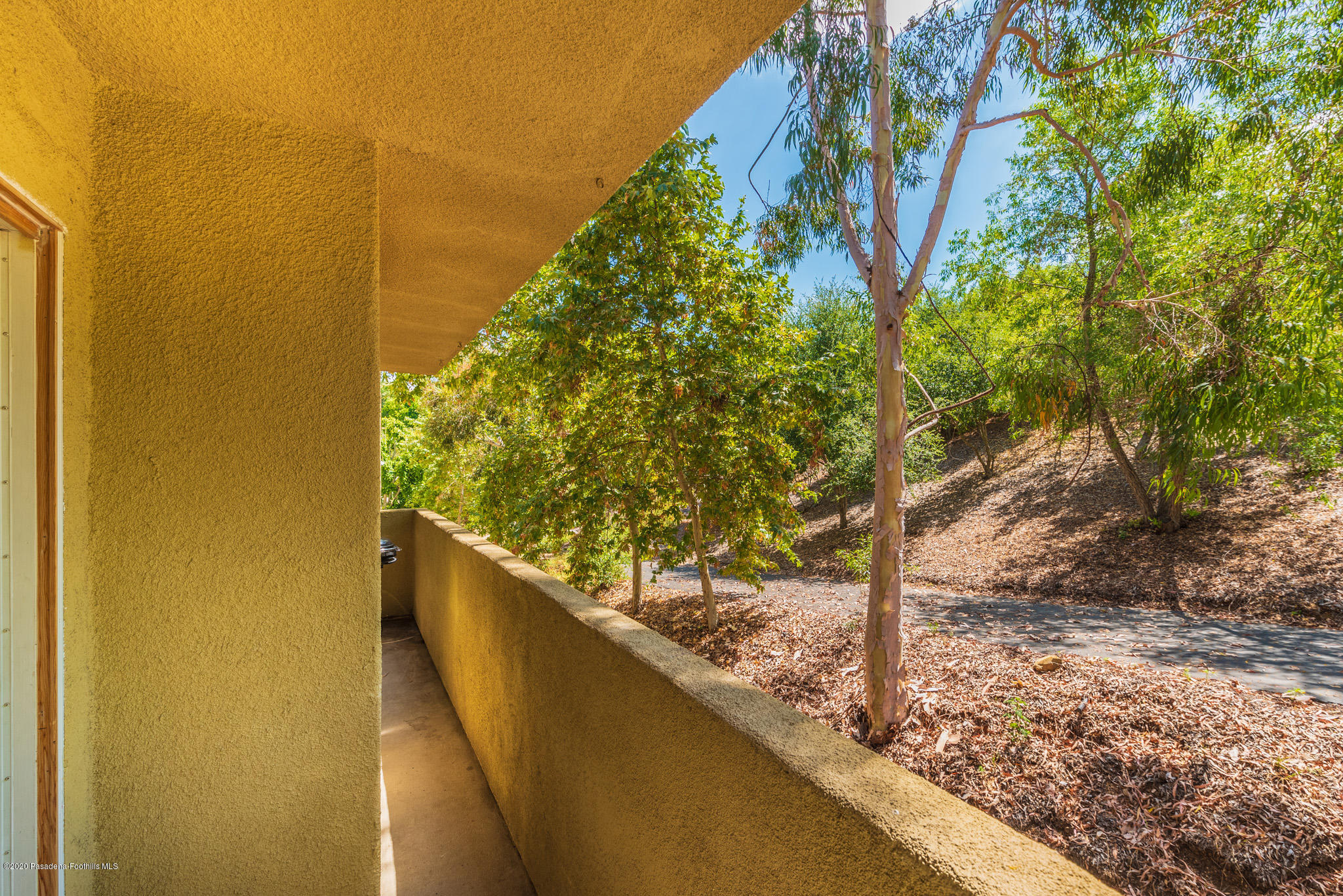 6140 Monterey Road, Unit 328 Los Angeles, CA 90042 - Photo 20 of 28 a view of a forest from a balcony