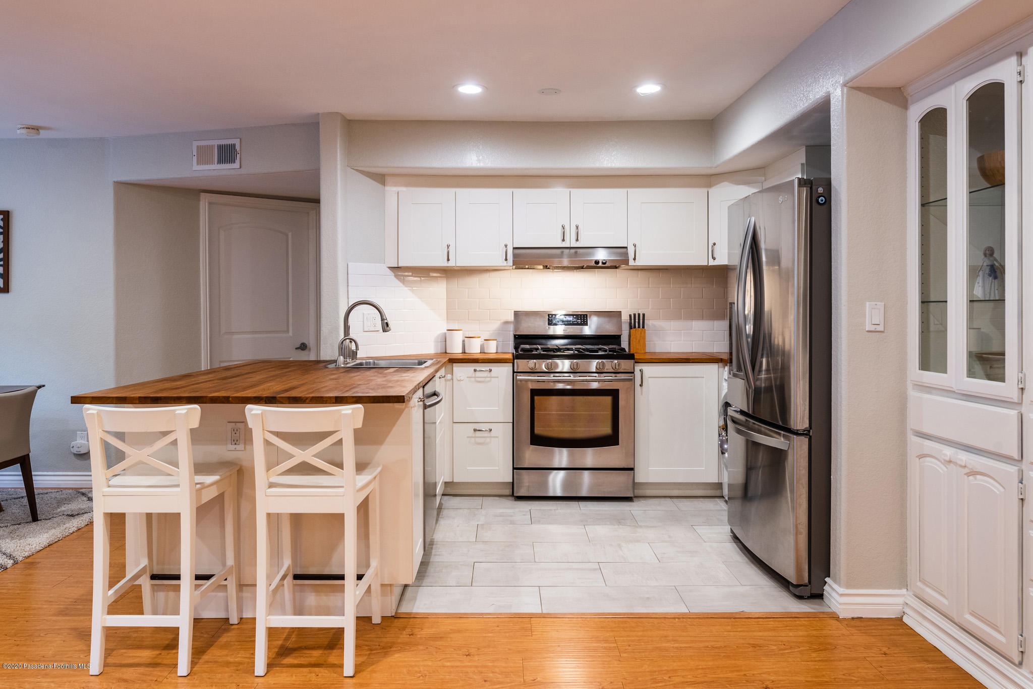 6140 Monterey Road, Unit 328 Los Angeles, CA 90042 - Photo 3 of 28 a kitchen with a stove sink and refrigerator