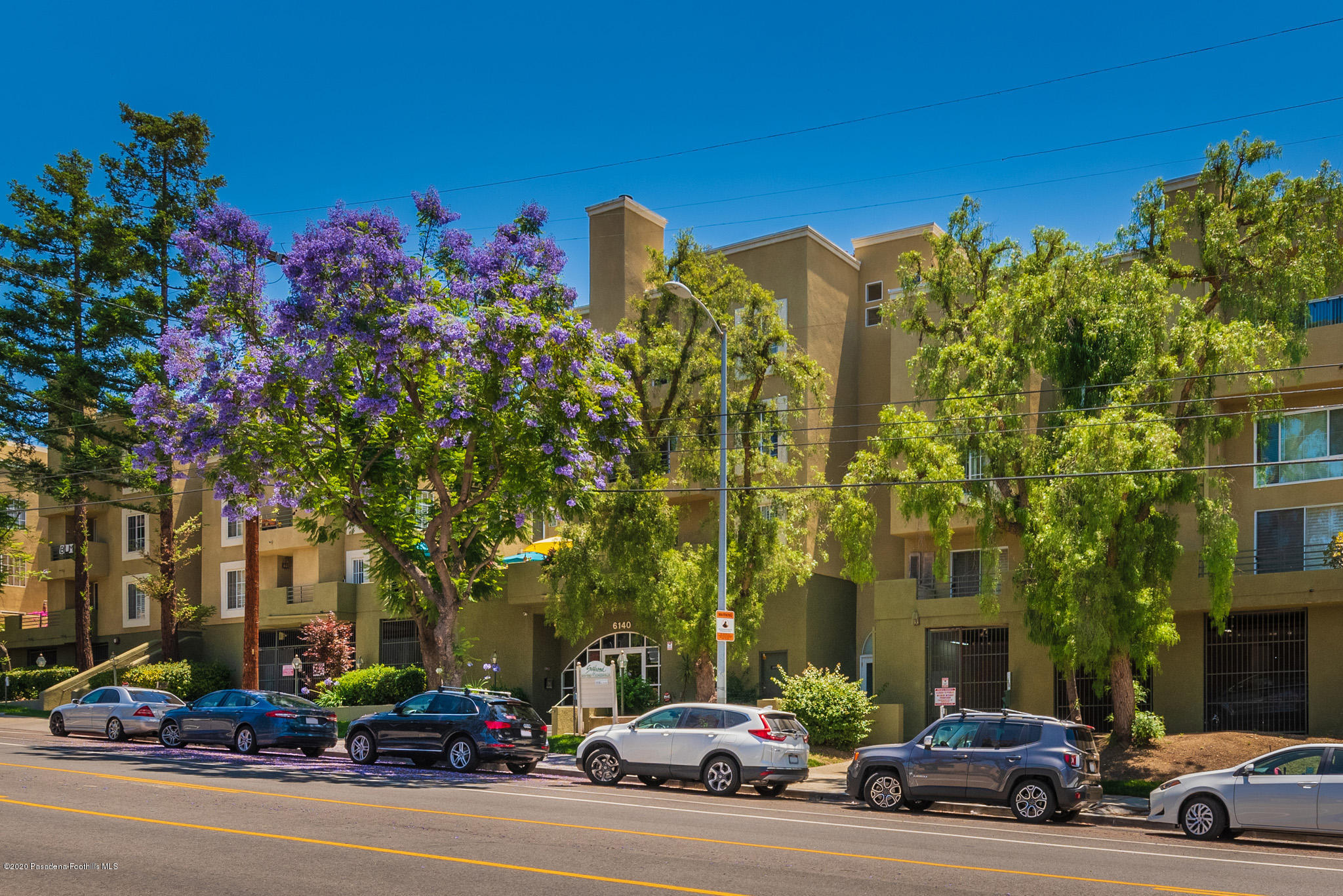 6140 Monterey Road, Unit 328 Los Angeles, CA 90042 - Photo 27 of 28 a city street lined with parked cars and buildings