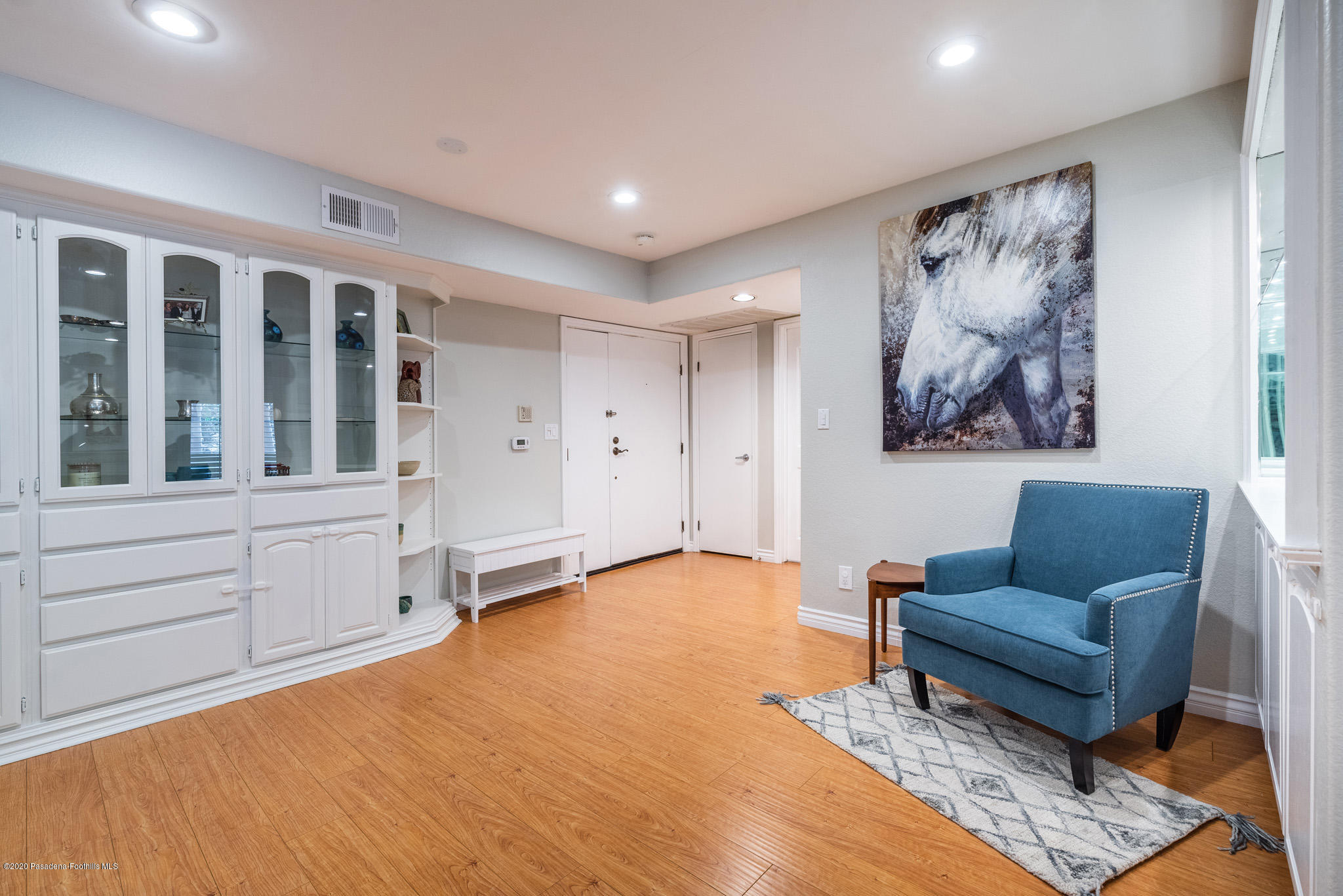 6140 Monterey Road, Unit 328 Los Angeles, CA 90042 - Photo 6 of 28 a living room with furniture and paintings on the wall