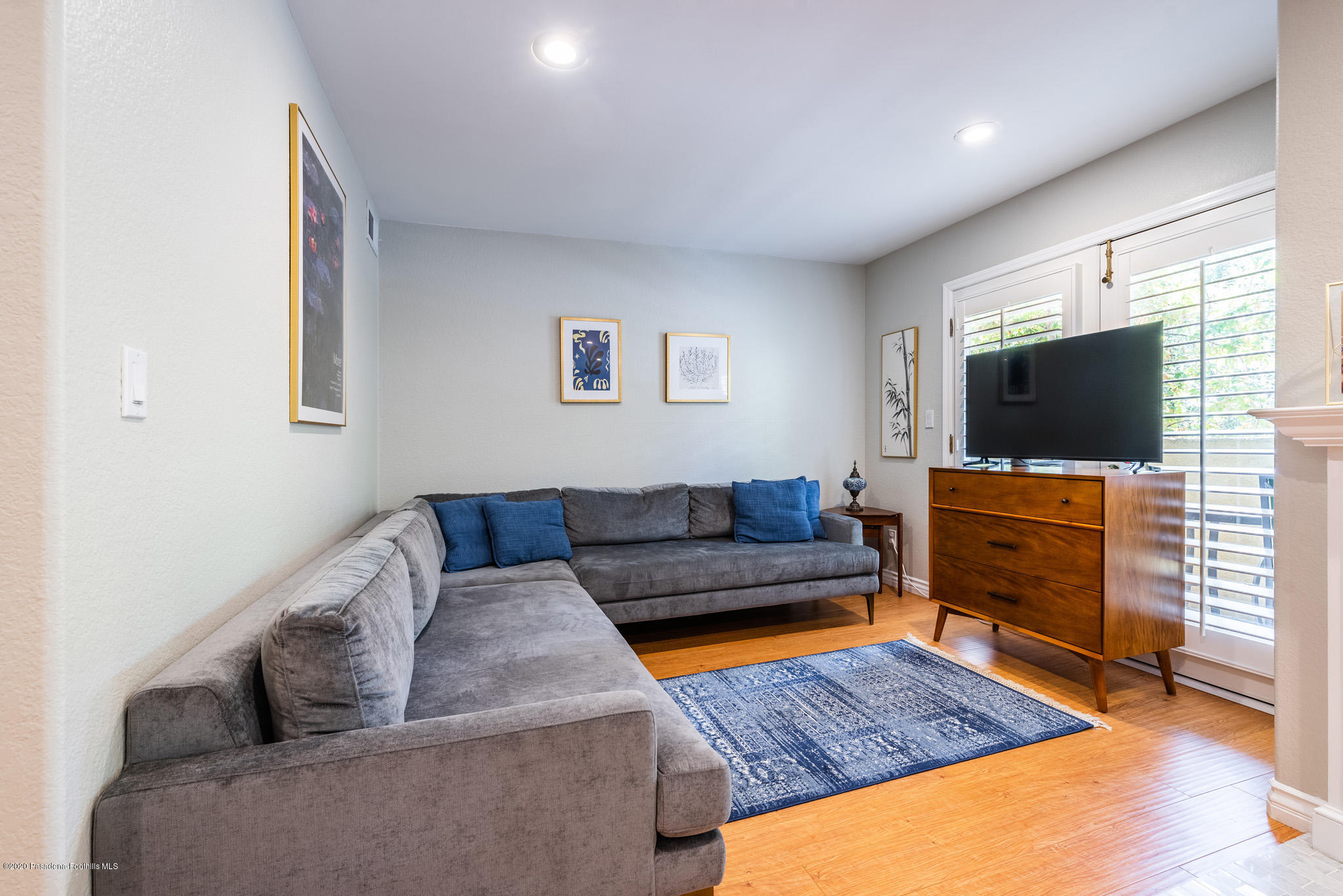 6140 Monterey Road, Unit 328 Los Angeles, CA 90042 - Photo 10 of 28 a living room with furniture and a flat screen tv