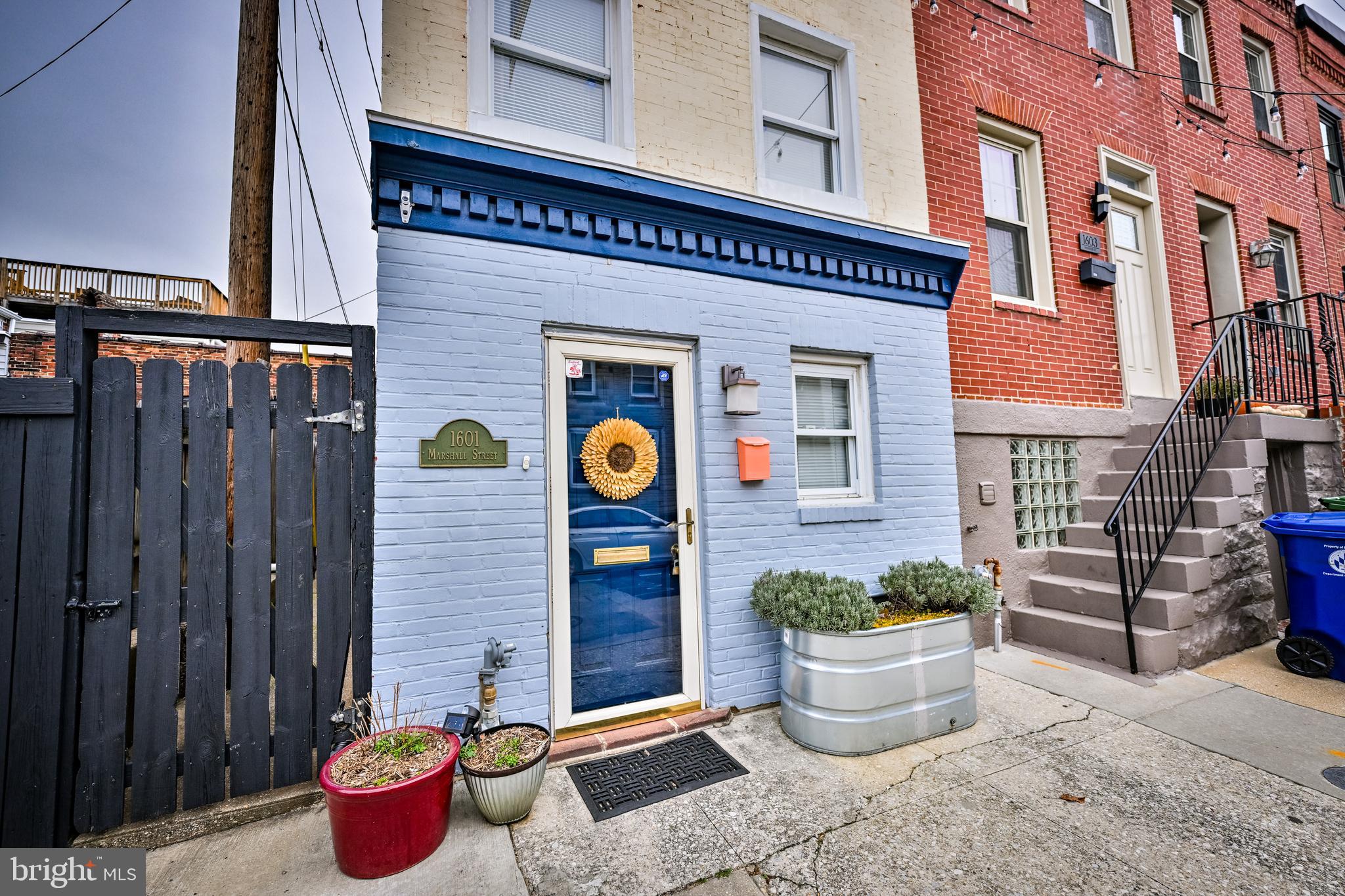 a view of a patio with couple of potted plants