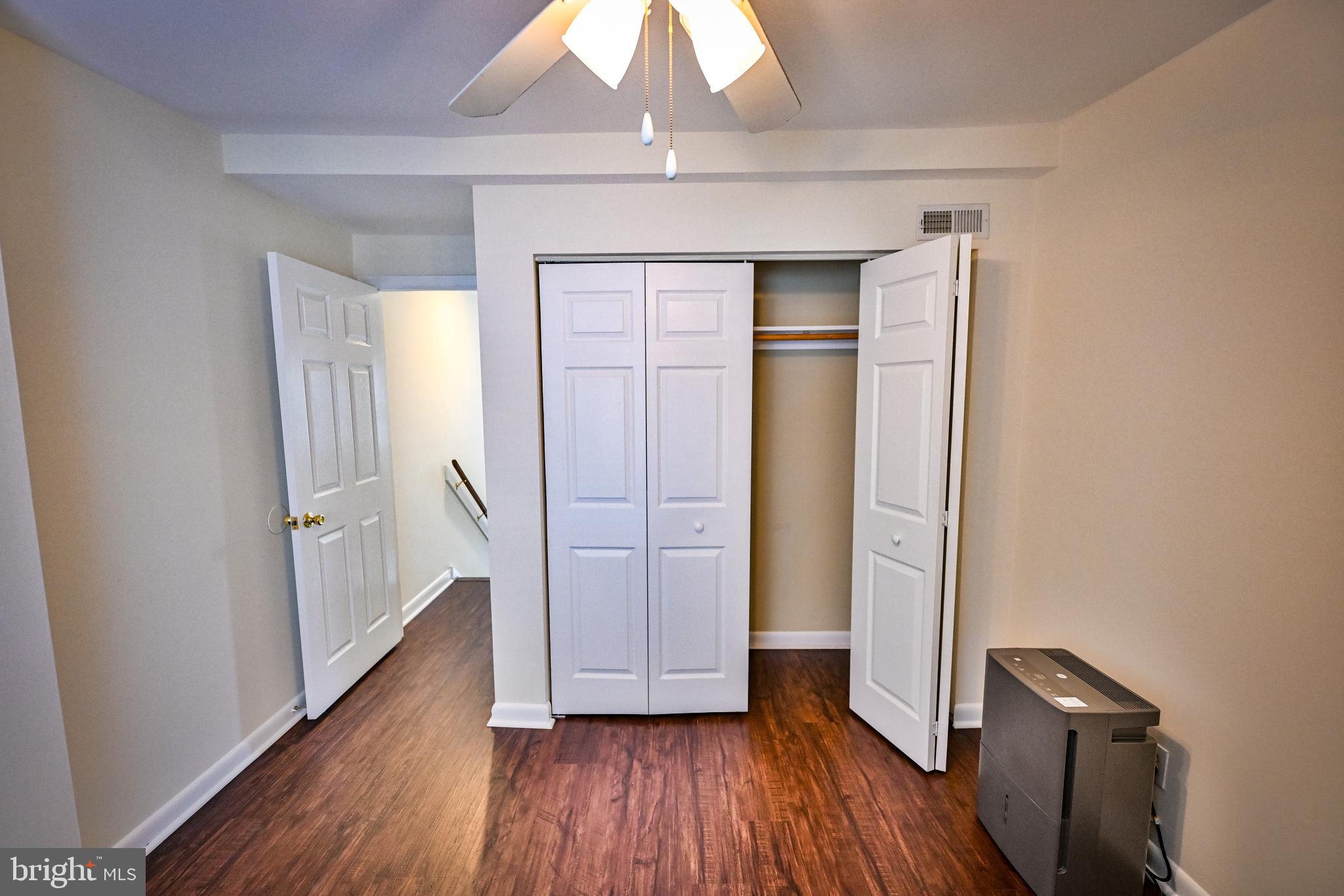 1601 Marshall Street Baltimore, MD 21230 - Photo 24 of 32 an empty room with wooden floor and closet