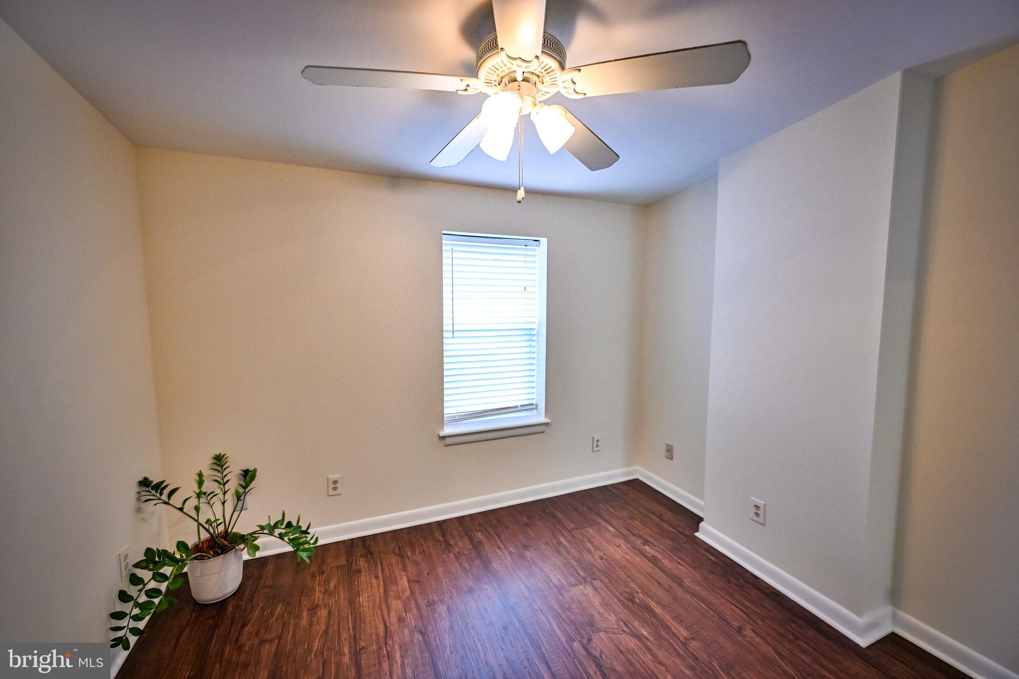 1601 Marshall Street Baltimore, MD 21230 - Photo 25 of 32 an empty room with a window and a fan