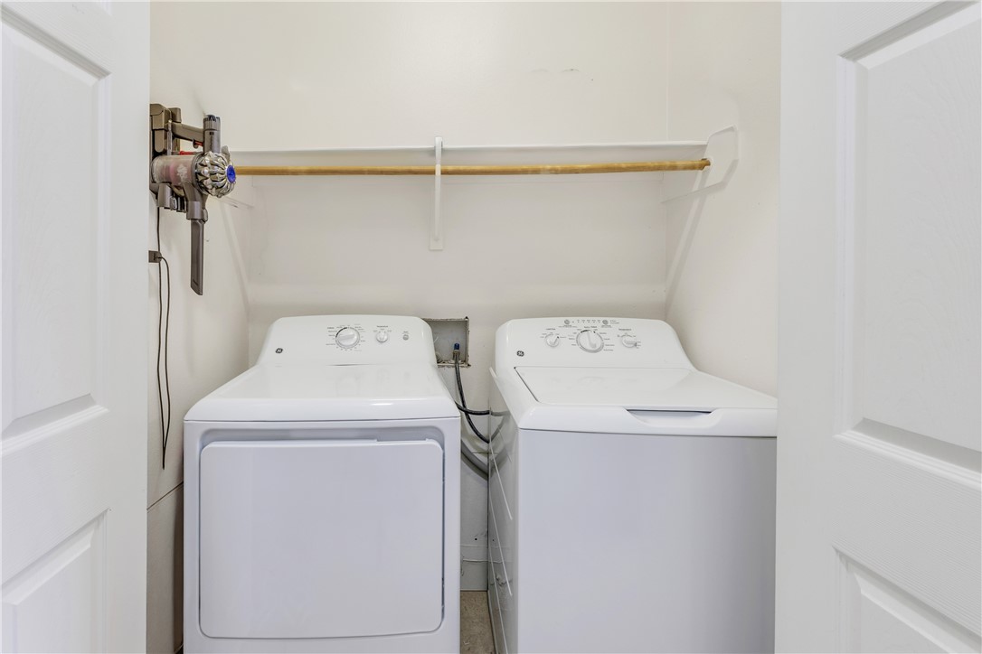 1425 West Villa Maria Road, Unit 1004 Bryan, TX 77801 - Photo 13 of 23 a utility room with dryer and washer