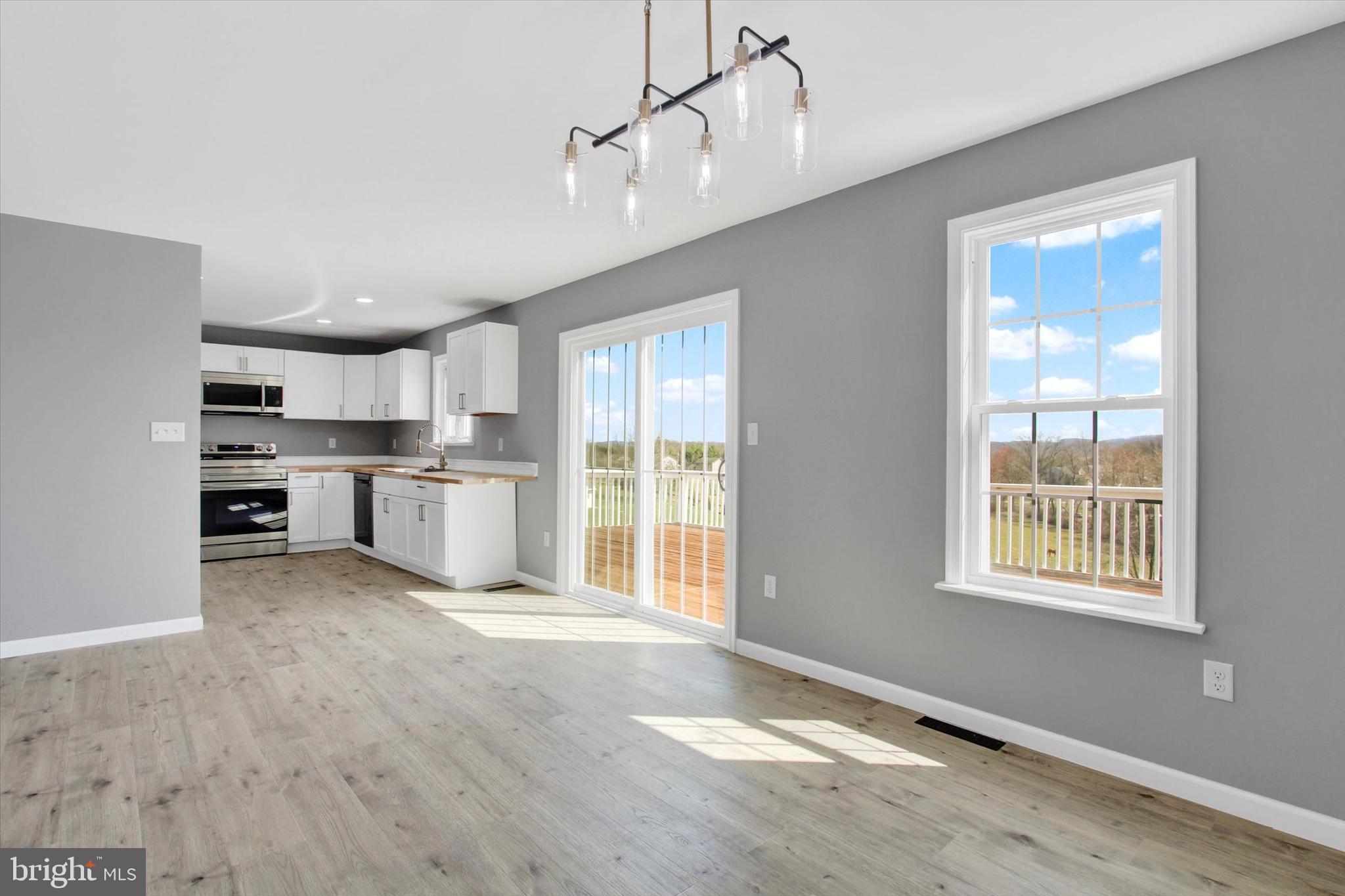 5086 Waltersdorff Road Spring Grove, PA 17362 - Photo 10 of 38 a view of kitchen with stainless steel appliances cabinets and wooden floor
