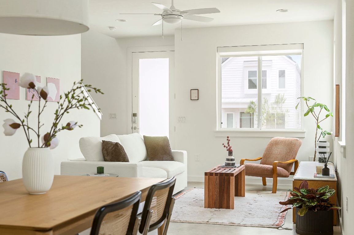 a living room with furniture and wooden floor