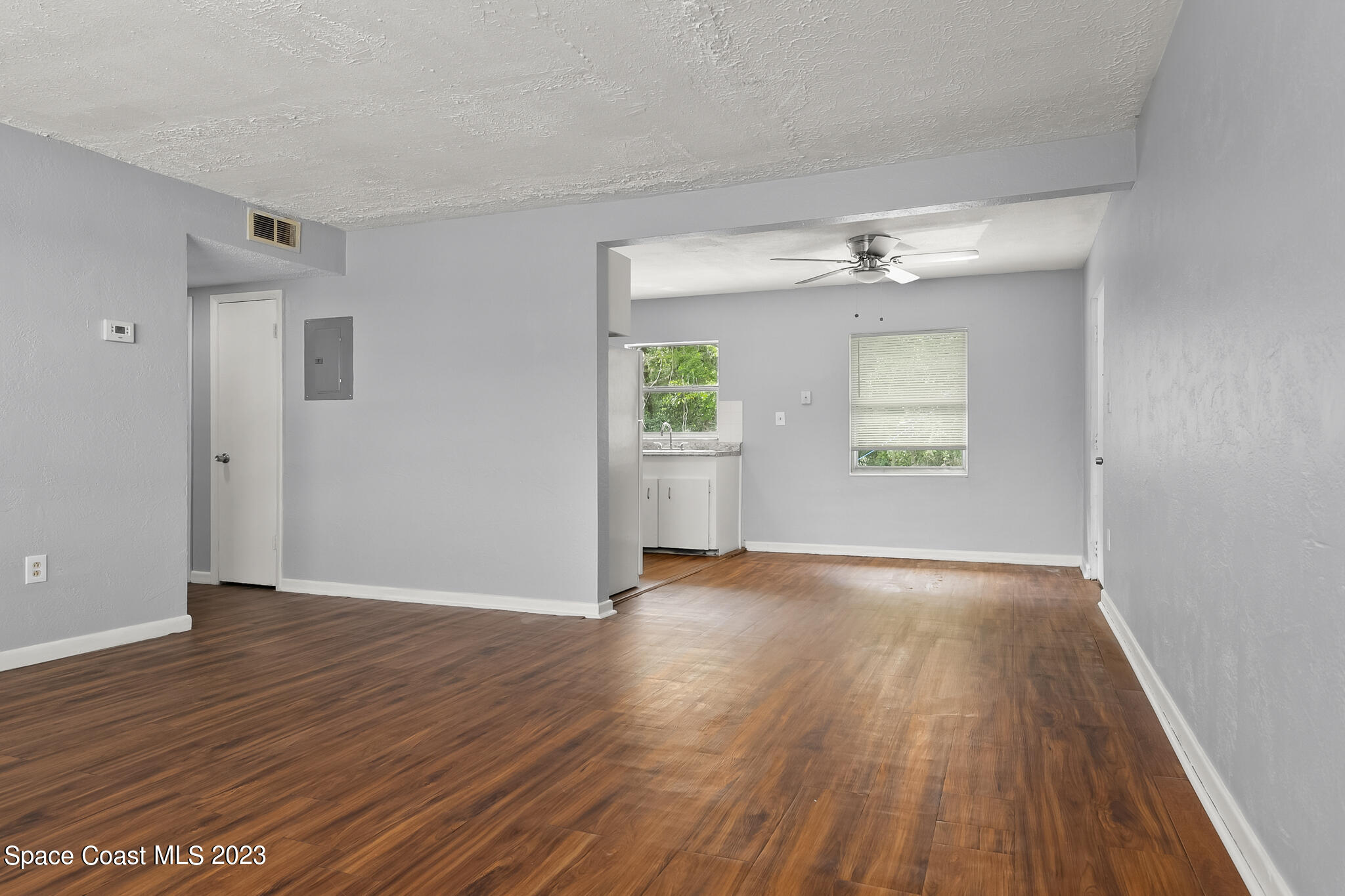 650 Dixon Boulevard, Unit B4 Cocoa, FL 32922 - Photo 1 of 21 an empty room with wooden floor and windows