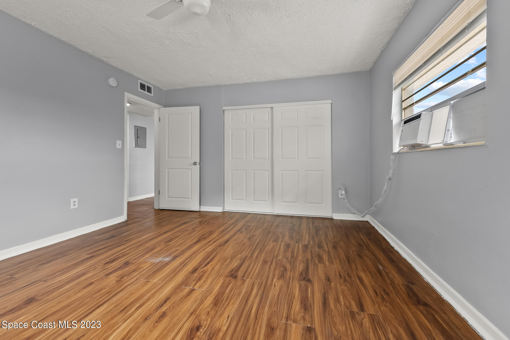 650 Dixon Boulevard, Unit B4 Cocoa, FL 32922 - Photo 18 of 21 a view of an empty room with wooden floor and a window