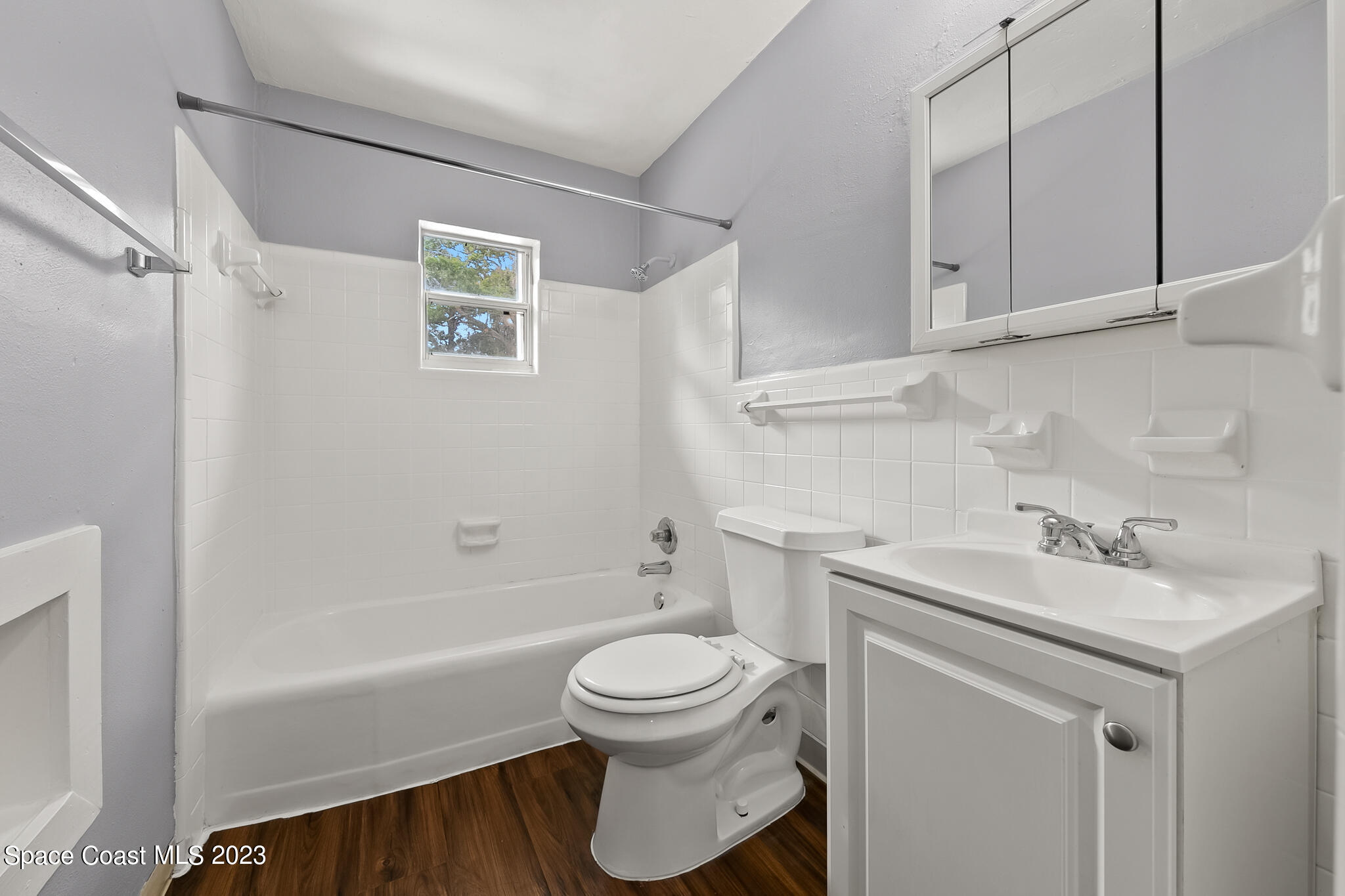 650 Dixon Boulevard, Unit B4 Cocoa, FL 32922 - Photo 19 of 21 a bathroom with a sink toilet vanity and tub