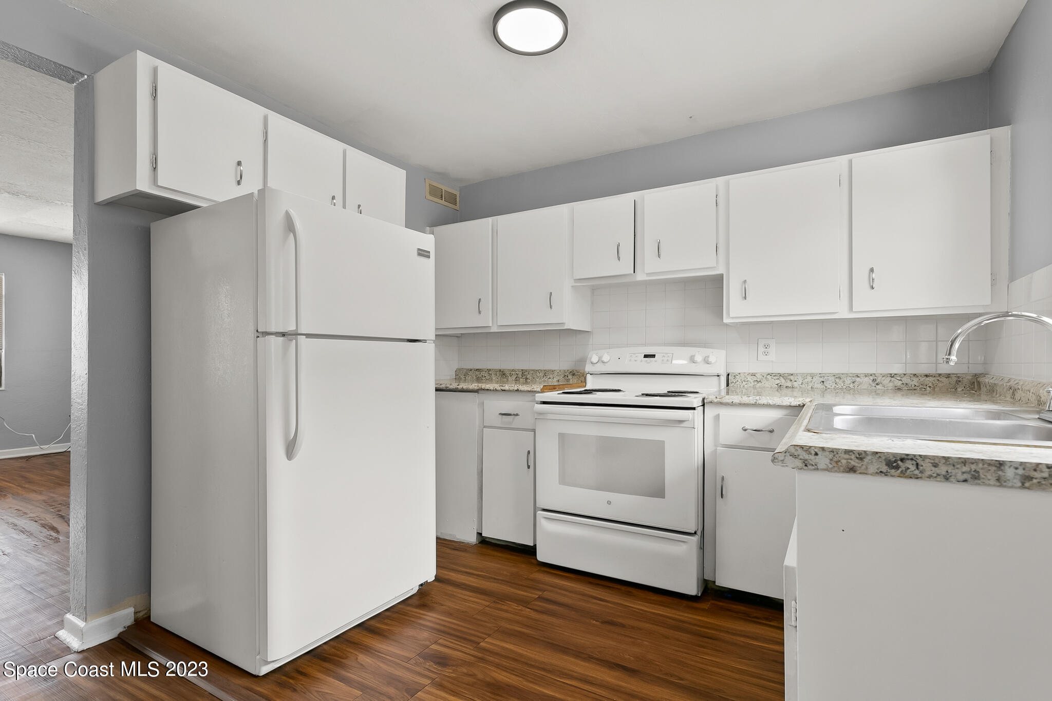 650 Dixon Boulevard, Unit B4 Cocoa, FL 32922 - Photo 10 of 21 a white refrigerator freezer sitting inside of a kitchen