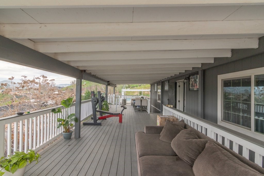 26460 Dale Street Hemet, CA 92545 - Photo 13 of 40 a view of a porch with furniture and floor to ceiling window
