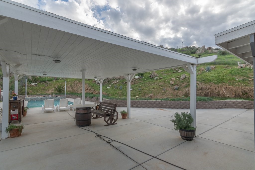 26460 Dale Street Hemet, CA 92545 - Photo 16 of 40 a view of a patio with chairs and a table