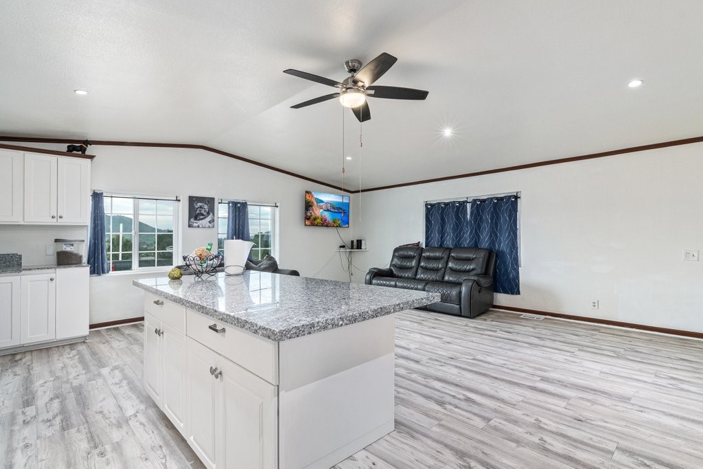 26460 Dale Street Hemet, CA 92545 - Photo 28 of 40 a kitchen with stainless steel appliances granite countertop a sink dishwasher a refrigerator and a stove with wooden floor