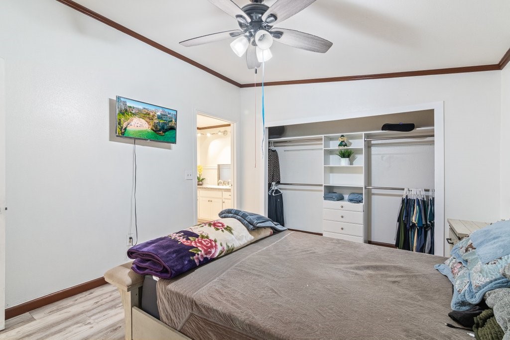 26460 Dale Street Hemet, CA 92545 - Photo 36 of 40 a bedroom with a bed and a chandelier