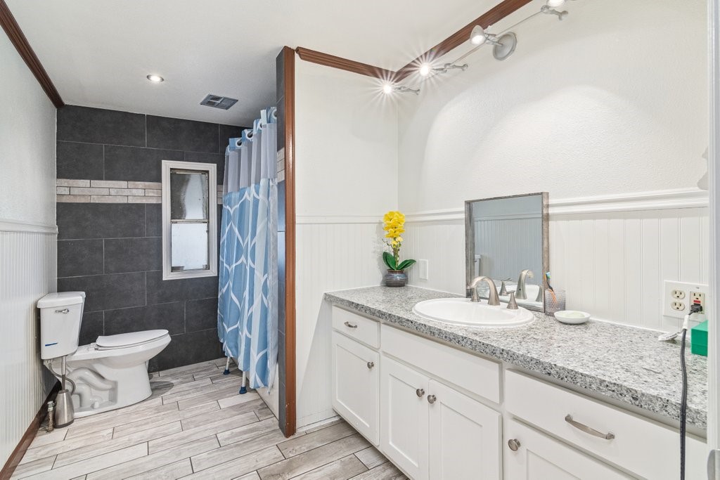 26460 Dale Street Hemet, CA 92545 - Photo 37 of 40 a bathroom with a granite countertop sink and a mirror