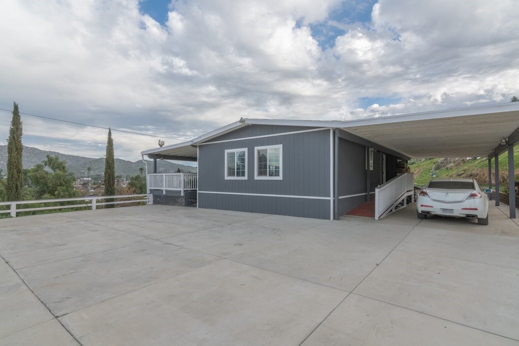 26460 Dale Street Hemet, CA 92545 - Photo 10 of 40 a view of parking space with garage and car parked