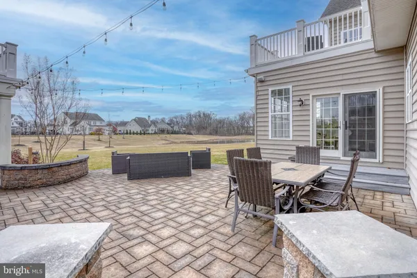 a backyard of a house with outdoor seating