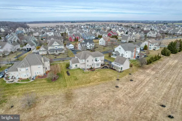 a aerial view of a house with table and chairs