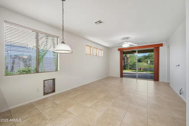 a view of an empty room with windows