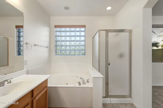 a bathroom with a sink a mirror and a bathtub