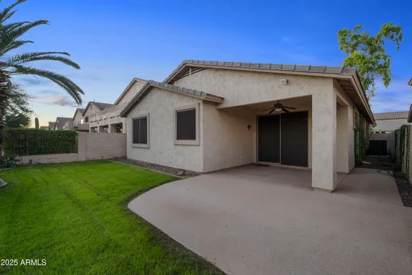 a view of a house with a backyard