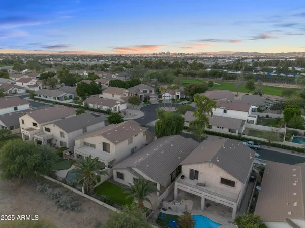 an aerial view of a house with a lake view