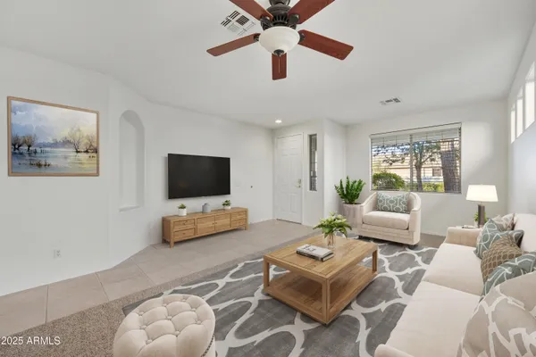 a living room with furniture and a flat screen tv