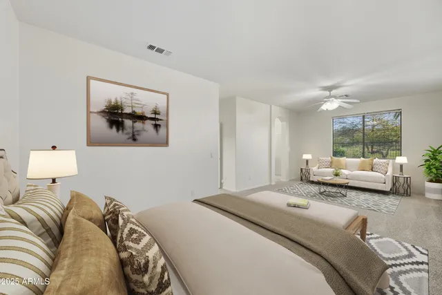 a bedroom with a large bed and a window