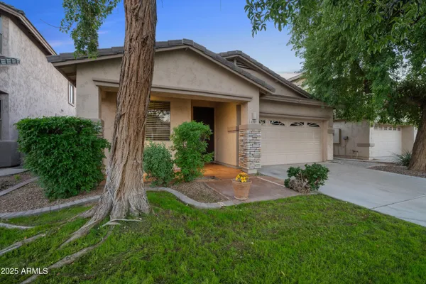 a front view of a house with a yard