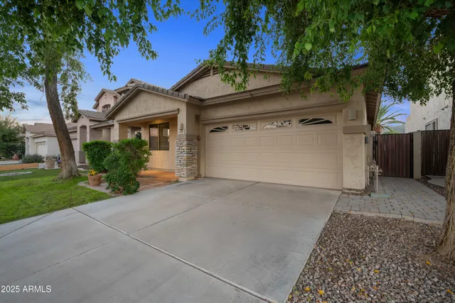 front view of a house with a garden