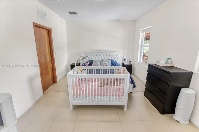 a bedroom with furniture and windows