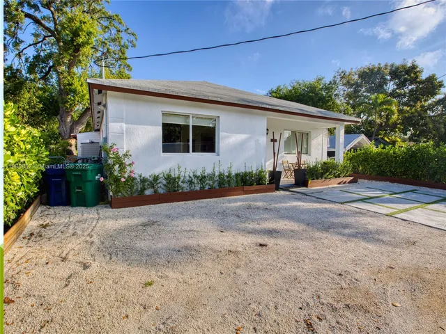 an aerial view of house with yard