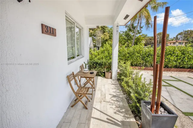 a view of a chairs and table in a patio