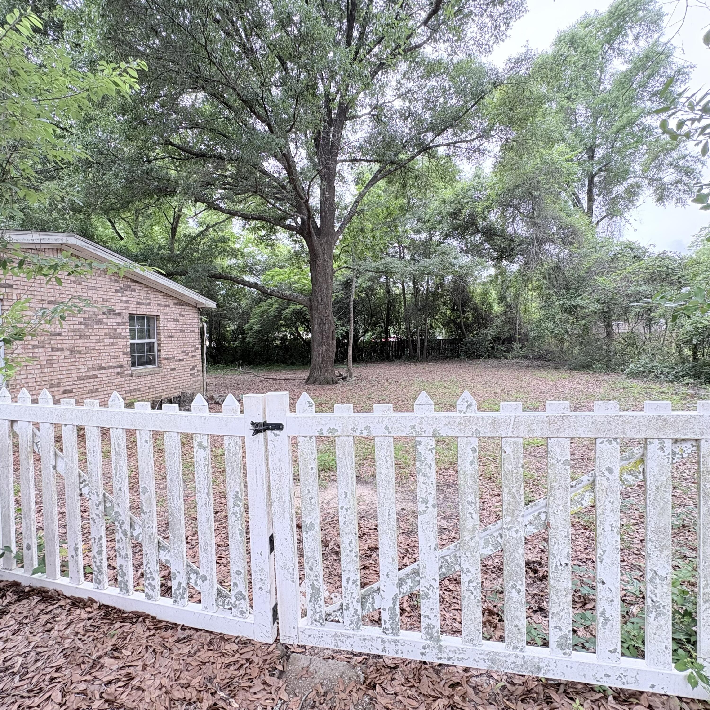 656 McClelland Street Crestview, FL 32536 - Photo 2 of 8 a view of wooden fence
