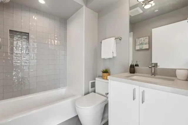 a bathroom with a sink toilet and bathtub