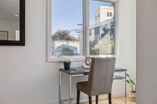 a dining room with furniture and window