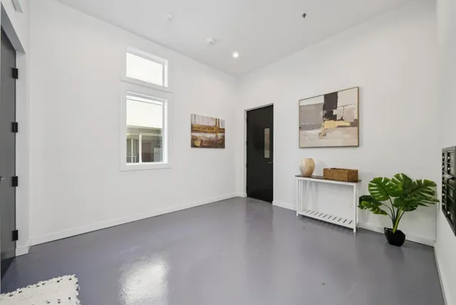 a view of staircase with white walls and windows